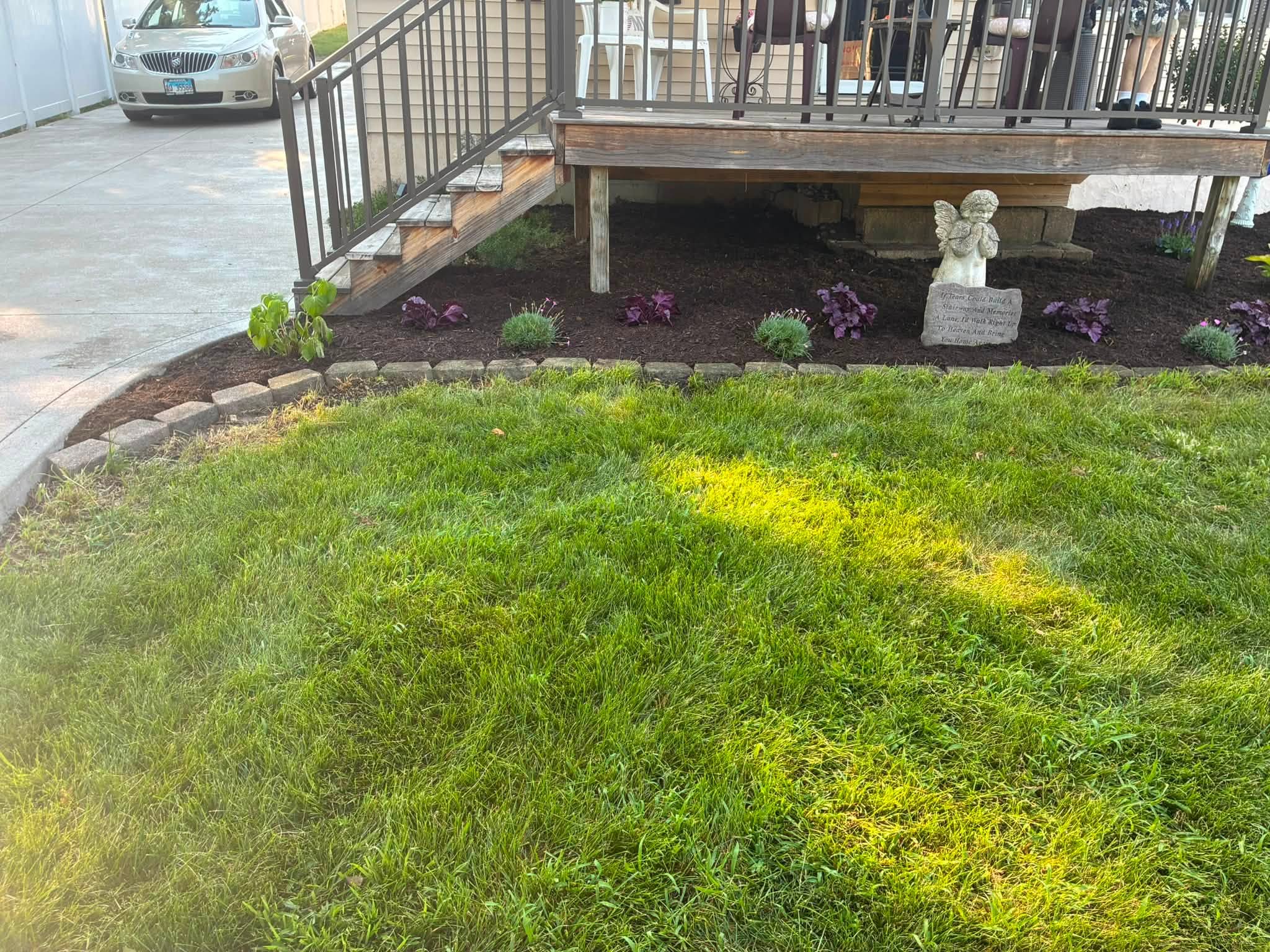 Freshly planted and mulched bed along the front porch